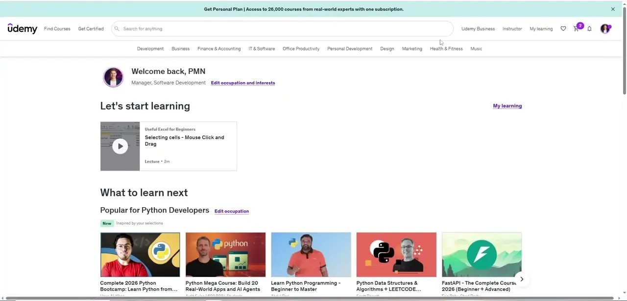 The Udemy dashboard after signing in, with recommended courses and a cart icon showing items ready for checkout.